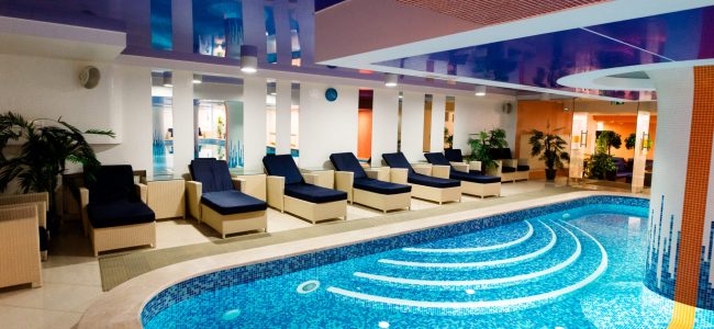 Beautiful blue pool with places for rest.
