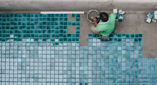 directly-shot-workers-installing-tiles-floor