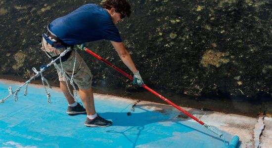 high-angle-view-man-painting-wall