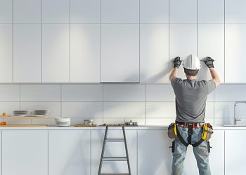 plasterboard-worker-installs-plasterboard-wall-kitchen-cabinets