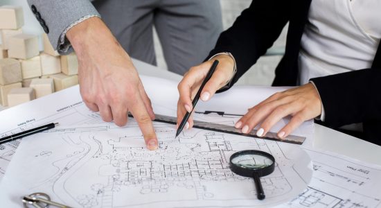 team-members-analyzing-architectural-plan