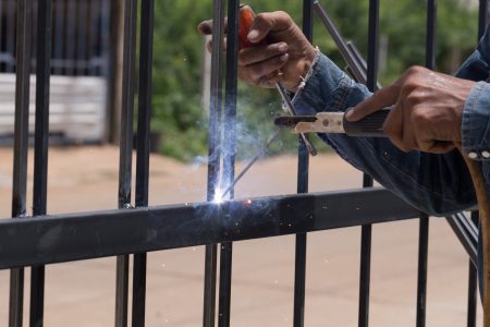 worker welding at manufacturing , welding door frames