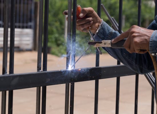 worker welding at manufacturing , welding door frames