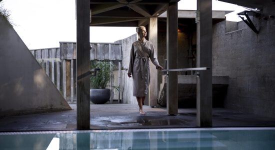 young-woman-standing-pool